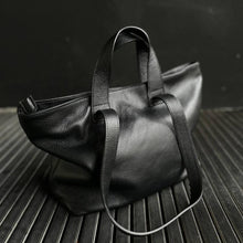 Lataa kuva Galleria-katseluun, REBECCA on monipuolinen ja supertilava shopper-nahkalaukku, jonka muoto elää mukanasi. Voit kantaa laukkua kahvoista tai olalla pitkällä hihnalla ja laukku mukautuu täydellisesti sisällön ja päivän tarpeiden mukaan. Pehmeä, laadukas nahka tekee laukusta yhtä aikaa ryhdikkään ja rennon. Vetoketju- ja magneettikiinnitys, sisällä vetoketjutasku ja avotaskut, hopeanväriset metalliosat.